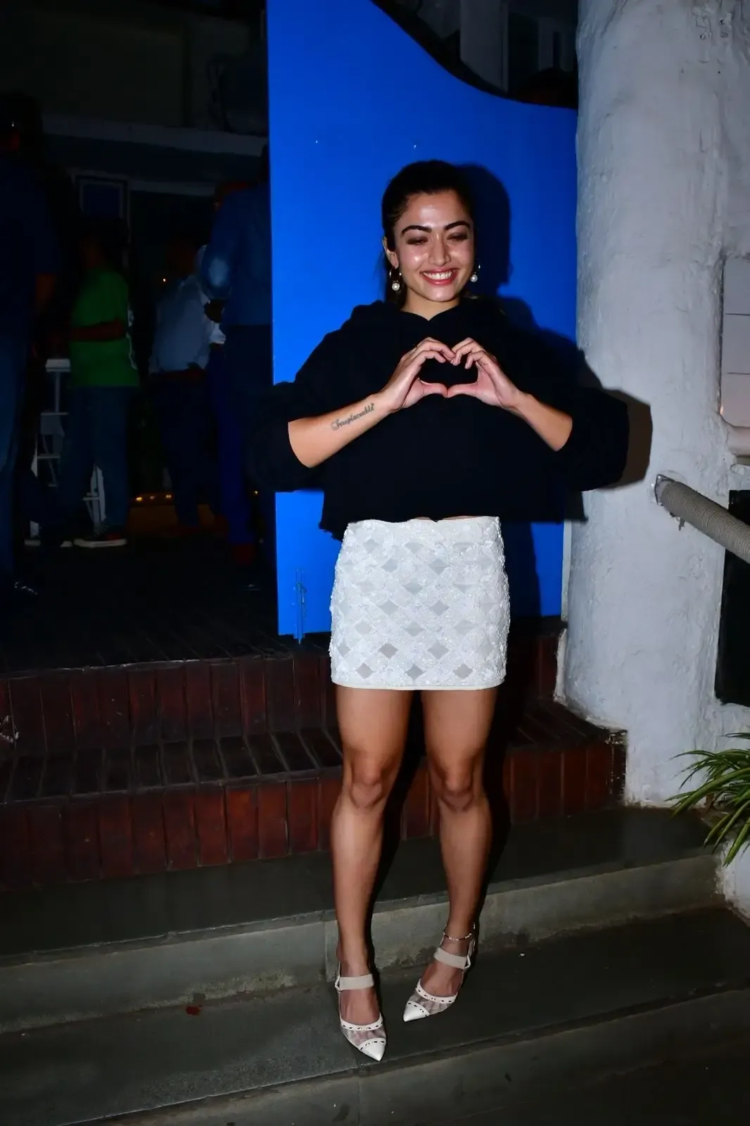 RASHMIKA MANDANNA LONG LEGS SHOW IN MINI WHITE SKIRT 2